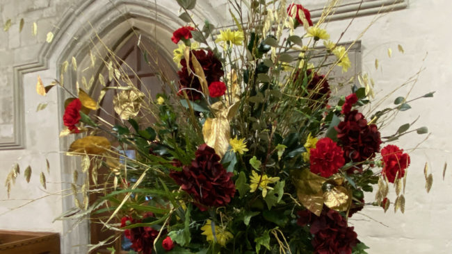 A church flower arrangement red and white