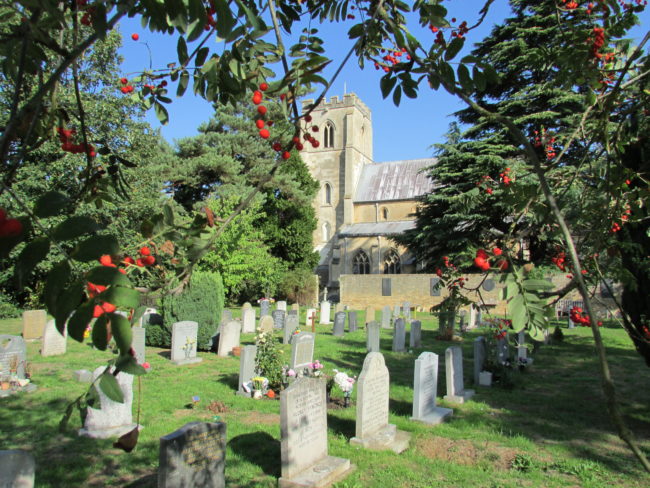 A churchyard with gravestones