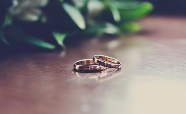 Two wedding bands on a table