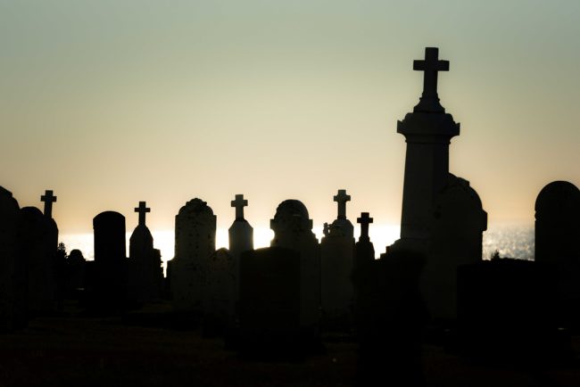 silhouette of gravestones